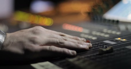 Audio Mixer panel concole control volume level record professional media technology mixing equipment digital music studio dj radio club producer channel broadcast close up hand production 4k - Powered by Adobe