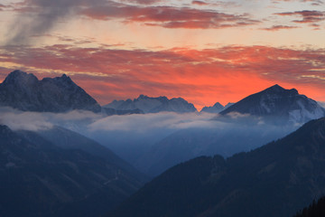 Fototapeta na wymiar Burning sunset over mountains