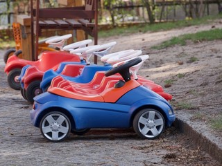 Fototapeta na wymiar Childrens ride on plastic cars