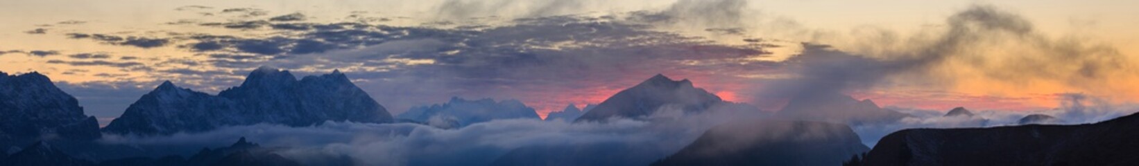 Burning sunset over mountains panorama