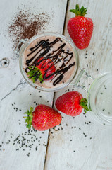 Homemade yogurt in a jar with strawberry