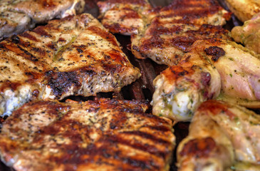 Baking fresh meat on grill closeup