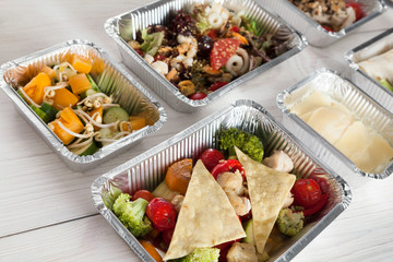 Healthy food take away, top view at wood background