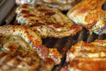 Baking fresh meat on grill closeup