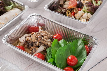Healthy food take away, top view at wood background