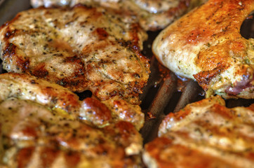 Baking fresh meat on grill closeup