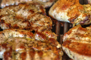 Baking fresh meat on grill closeup