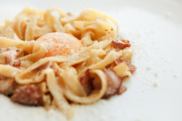 Traditional italian pasta carbonara with bacon and egg