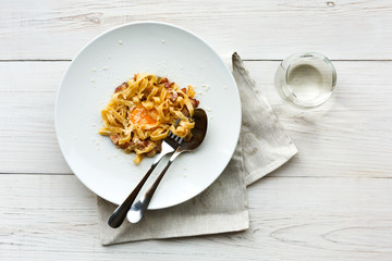 Traditional italian pasta carbonara with bacon and egg