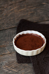 Chocolate souffle with walnuts and cocoa powder