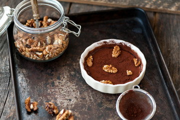 Chocolate souffle with walnuts and cocoa powder