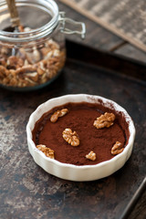 Chocolate souffle with walnuts and cocoa powder
