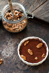 Chocolate souffle with walnuts and cocoa powder