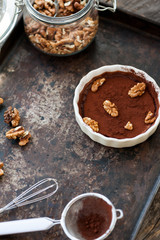 Chocolate souffle with walnuts and cocoa powder
