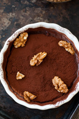 Chocolate souffle with walnuts and cocoa powder