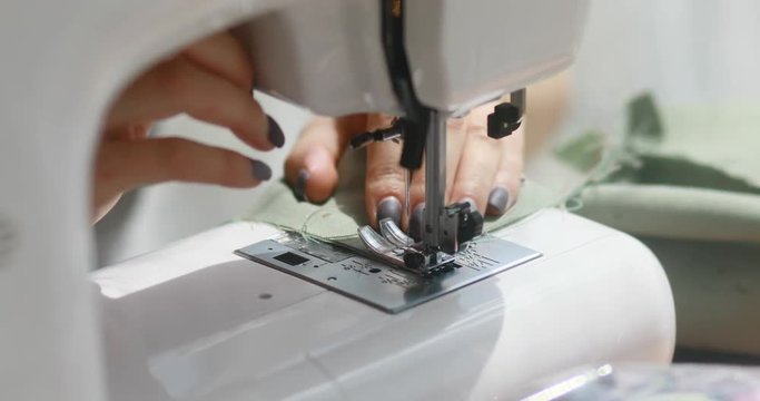 Sewing machine seamstress sew dress in textile factory cloth tailor clothing fabric thread craft industry needle garment handicraft production 4k