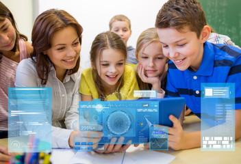 group of kids with teacher and tablet pc at school