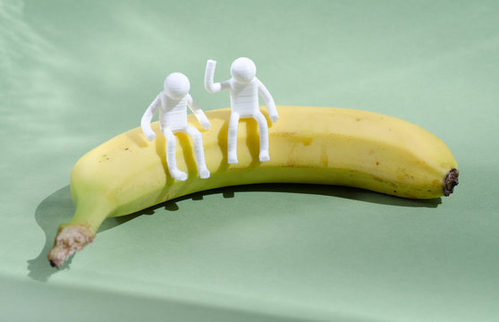People Sitting On A Banana