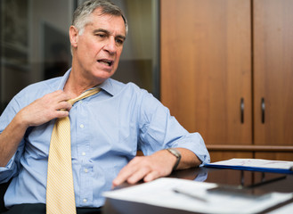 Businessman sweating in his office