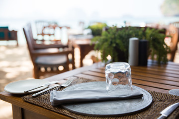 served table at open-air restaurant on beach