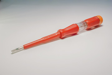 voltage tester screwdriver closeup on white