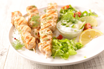 grilled chicken skewer and salad