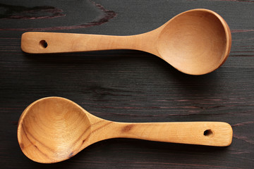 Wooden spoons on a dark background