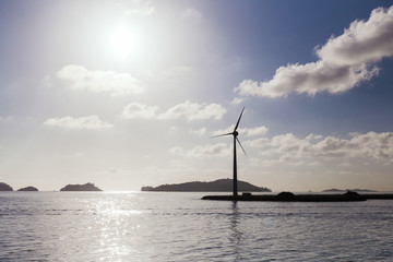 turbines at wind farm on sea shore