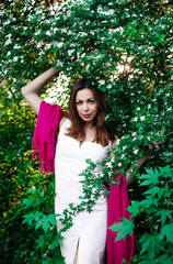 Young girl in complete tranquility and pacification in a beautiful and elegant dress on nature in...