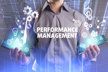 Business, Technology, Internet and network concept. Young businessman working on a virtual screen of the future and sees the inscription: Performance management