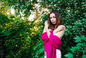  Young girl in complete tranquility and pacification in a beautiful and elegant dress on nature in...