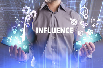 Business, Technology, Internet and network concept. Young businessman working on a virtual screen of the future and sees the inscription: Influence