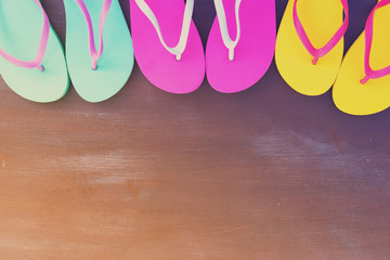 Summer beach fun - border of flip flop sandals, retro toned