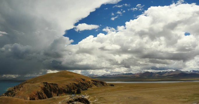 4k huge clouds mass rolling over lake namtso & & peninsula,tibet mansarovar,Tibet's second largest lake,is the third largest saltwater lake in China.