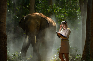 Beautiful woman and elephant with Thai teacher ,vintage style