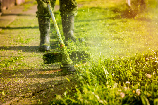 man mowing the grass, the mower close up