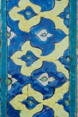 Fototapeta na wymiar asian old ceramic mosaic. elements of oriental ornament on ceramic tiles