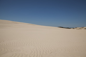 Sand, dunes, blue sky