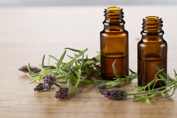 Lavender essential oil and fresh lavender flowers