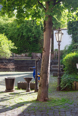 tree lamp and old water pump in Cochem Germany
