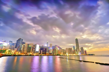 Fototapeta na wymiar Victoria Harbor and Hong Kong skyline at sunset