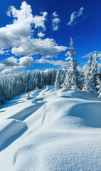 Snowdrifts on winter snow covered mountainside