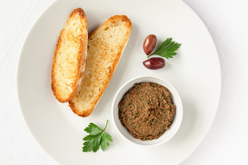 olive pate and fried white bread slices