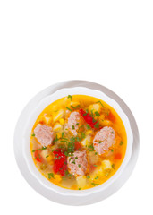 Soup with meatballs and vegetables. top view. isolated on white