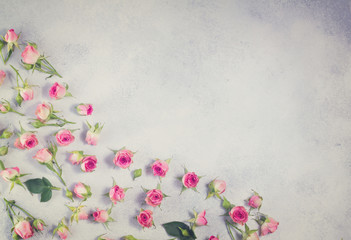 Pink flowers pattern with copy space on gray background, retro toned