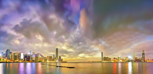 Fototapeta na wymiar Victoria Harbor and Hong Kong skyline at dusk.
