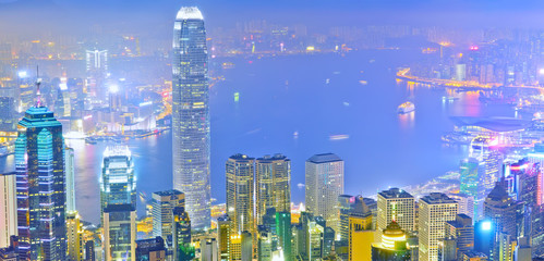 Victoria Harbor and Hong Kong skyline at night.