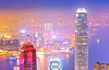 Victoria Harbor and Hong Kong skyline at night.