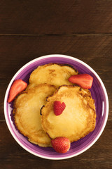 Freshly baked homemade pancakes with fresh fruit