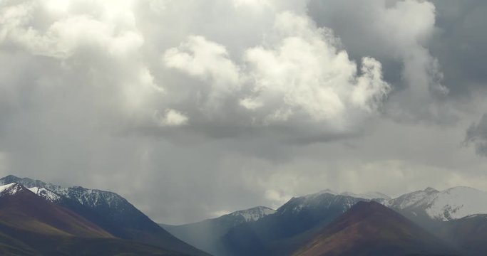4k white puffy clouds mass rolling over Tibet mountaintop & valley,roof of the World,Danggula(Tanggula) Mountains in xizang Plateau,roof of the World.	